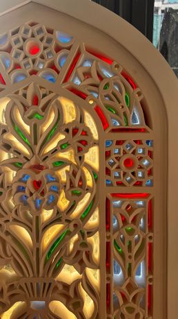 Detail of plaster carving and stained glass